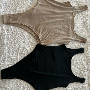 2 thong style body suits-never worn